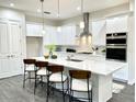 Bright kitchen with stainless steel appliances, a large island, and modern finishes at 8290 Nw 17Th Cir, Ocala, FL 34475