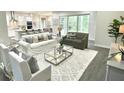 Cozy living room with an open floor plan, comfortable seating, and lots of natural light at 8290 Nw 17Th Cir, Ocala, FL 34475