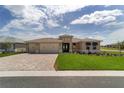 Inviting single-story home boasting a well-manicured lawn and a convenient three-car garage at 9813 Sw 105Th Ct, Ocala, FL 34481