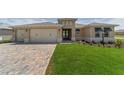 Attractive single-story home featuring a lush lawn and a spacious three-car garage at 9813 Sw 105Th Ct, Ocala, FL 34481