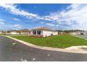 Sprawling well-maintained lawn surrounds a single-Gathering home, offering curb appeal at 10553 Sw 98Th Pl, Ocala, FL 34481