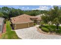 Expansive home with a three-car garage and beautiful landscaping at 1429 Sw 160Th Ln, Ocala, FL 34473
