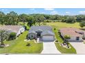Beautiful aerial view of the home showcasing its landscaping and golf course surroundings at 15119 Sw 14Th Avenue Rd, Ocala, FL 34473