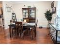 Formal dining room featuring hardwood floors, a stylish dining set, and elegant decor at 231 Ne 28Th Ave # 207, Ocala, FL 34470