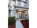 Inviting front porch with outdoor seating and decorative plants, creating a cozy entrance at 231 Ne 28Th Ave # 207, Ocala, FL 34470