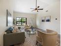 Bright living room with natural light, neutral décor and sleek ceiling fan at 346 Emerald Rd, Ocala, FL 34472