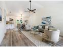 Open-concept living room with high ceilings, modern furniture and wood-look flooring at 346 Emerald Rd, Ocala, FL 34472