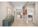 Neutral-toned foyer with hardwood flooring and an open view into the living spaces at 7917 Sw 85Th Loop, Ocala, FL 34476