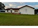 Charming single story home with a well-manicured lawn and mature landscaping at 8770 Sw 196Th Terrace Rd, Dunnellon, FL 34432
