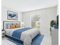 Calm bedroom featuring a comfortable bed, bright window, and decor for a restful retreat at 1801 Caralee Blvd # 2, Orlando, FL 32822