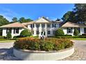 Beautiful home with a flower garden in the front at 4026 Nw 85Th Ter, Ocala, FL 34482