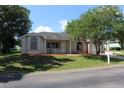 Charming single-story home with a well-manicured lawn and a welcoming front porch at 5110 Nw 19Th Pl, Ocala, FL 34482