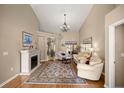 Bright and airy living room featuring a fireplace, high ceilings, and neutral color palette at 5174 Se 41St Ave, Ocala, FL 34480