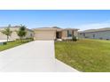 Attractive single-story home featuring a neat lawn and landscaped front yard, coupled with a two car garage at 5842 Sw 78Th Avenue Rd, Ocala, FL 34474
