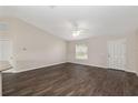 Inviting living room featuring modern flooring, white trim, and ample natural light at 6561 Sw 129Th Loop, Ocala, FL 34473