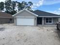 Charming single-story home with a two-car garage and well-manicured lawn at 7637 Sw 180Th Cir, Dunnellon, FL 34432