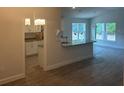 Open-concept living area featuring hardwood floors and lots of natural light at 7637 Sw 180Th Cir, Dunnellon, FL 34432