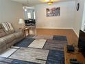Bright living room featuring hardwood floors and a modern rug at 8801 Sw 92Nd St # B, Ocala, FL 34481