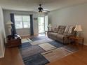 Inviting living room with a ceiling fan and a front door at 8801 Sw 92Nd St # B, Ocala, FL 34481
