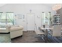 Bright living room featuring stylish furniture, wood floors and lots of natural light at 15324 Sw 40Th Place Rd, Ocala, FL 34481
