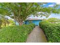 Inviting home with a well-maintained lawn and mature trees adding natural beauty at 17128 Se 140Th Ave, Weirsdale, FL 32195