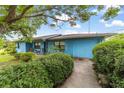 Welcoming home featuring a garage and a neatly landscaped front yard at 17128 Se 140Th Ave, Weirsdale, FL 32195