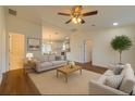 Cozy living room featuring hardwood floors and modern furniture; an open concept design at 3529 Sw 150Th Ct, Dunnellon, FL 34432