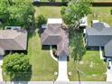 Aerial view of home with mature landscaping, large backyard, and a long driveway at 4085 Ne 17Th Ave, Ocala, FL 34479