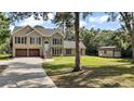 Well-kept home with manicured lawn and a convenient storage shed on a large lot at 4673 Se 115Th St, Belleview, FL 34420