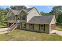 Attractive home with attached garage, tidy landscaping, and a welcoming facade at 4673 Se 115Th St, Belleview, FL 34420