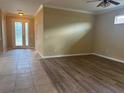 Open-concept living room with hardwood flooring and lots of natural light at 4940 Sw 63Rd Loop, Ocala, FL 34474