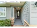 Inviting entryway showcasing stone accents and neutral siding, creating a warm welcome at 5651 Nw 40Th Pl, Ocala, FL 34482