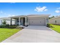 Charming single-story home with a well-manicured lawn and a two-car garage at 7203 Sw 86Th Ave, Ocala, FL 34481