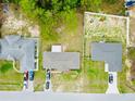 Aerial view showcasing the property with a fenced backyard and surrounding neighborhood homes at 9 Bahia Trace Loop, Ocala, FL 34472