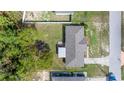 Aerial view of a home with a well-kept backyard and surrounded by mature trees at 9 Bahia Trace Loop, Ocala, FL 34472