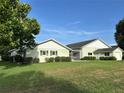 Spacious house with well maintained lawn, landscaping and exterior shutters at 9622 Se 71St Ct, Ocala, FL 34472