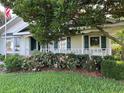 Inviting home exterior with a well-manicured garden and flowers at 9622 Se 71St Ct, Ocala, FL 34472