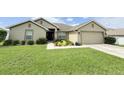 Well-maintained lawn and landscaping enhance the curb appeal of this home at 186 Nw 44Th St, Ocala, FL 34475