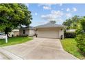 Charming single-story home with attached two-car garage and freshly painted exterior at 2644 Sw 20 Cir, Ocala, FL 34471