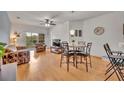 Light filled living room with hardwood floors, ceiling fan and balcony access at 4897 Cypress Wood Dr # 6313, Orlando, FL 32811