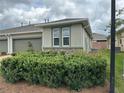Charming home with a well-manicured lawn and a two-car garage, offering curb appeal and convenience at 5255 Nw 33Rd Pl, Ocala, FL 34482