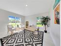 A clean office space with natural light and neutral walls, features tile floors and modern décor at 130 Nw 113Th Cir, Ocala, FL 34482