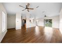 Spacious living room showcases hardwood floors, ceiling fans, and open layout at 263 Chestnut Rd, Ocala, FL 34480