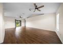 Open living room featuring hardwood floors, ceiling fans and natural light at 263 Chestnut Rd, Ocala, FL 34480