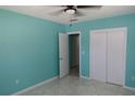Bedroom features modern closet and tile floor at 2810 Se Lake Weir Ave, Ocala, FL 34471