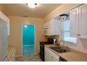 Kitchen features modern appliances and white cabinetry at 2810 Se Lake Weir Ave, Ocala, FL 34471