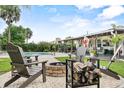 Relaxing backyard setup with a fire pit and Adirondack chairs, creating a cozy and inviting atmosphere at 460 E Haines Blvd, Lake Alfred, FL 33850