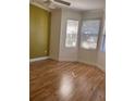 Bedroom with natural light from multiple windows and featuring wood flooring at 8298 Sw 79Th Cir, Ocala, FL 34476