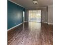 Spacious living room featuring wood floors, recessed lighting, and access to a sunroom at 8298 Sw 79Th Cir, Ocala, FL 34476