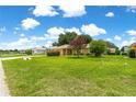 Lovely home surrounded by a lush green lawn and mature trees, in a quiet neighborhood at 8732 Sw 60Th Cir, Ocala, FL 34476